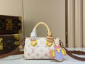 Mini Monogram Canvas Handbag with Bird Charm