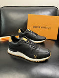 Louis Vuitton Run Away Sneaker in black calfskin leather with gold LV monogram emblem, shown with original orange Louis Vuitton gift box