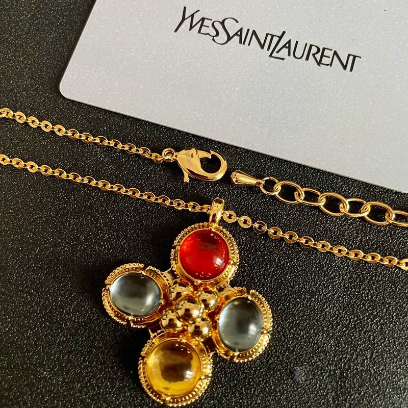 YSL multi-stone gold pendant necklace with red, amber, and grey cabochon stones on gold chain